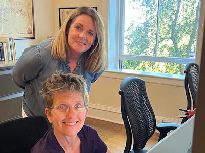 volunteer helping library patron